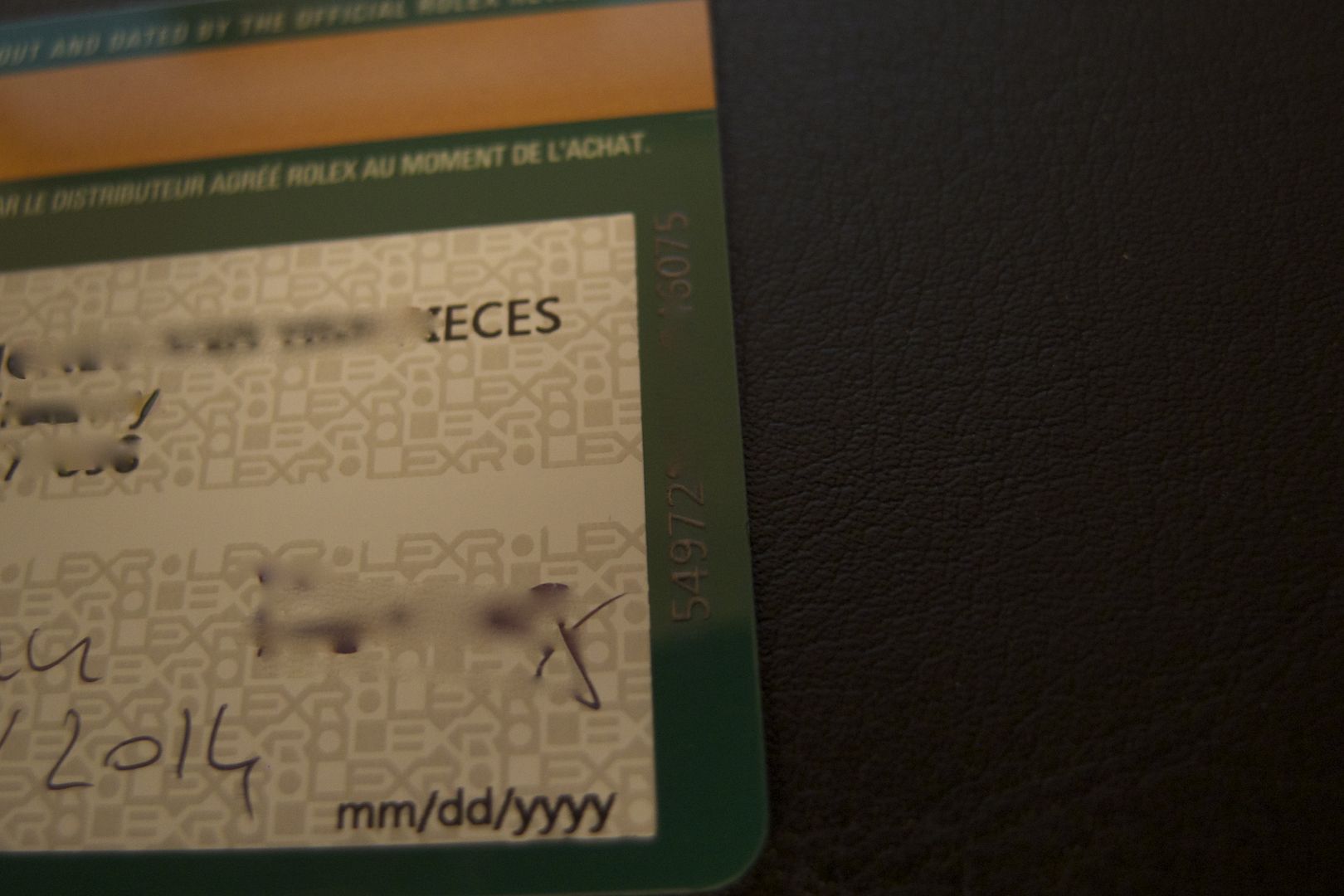 Unique serial identifier number on bottom right corner of new updated Rolex warranty card