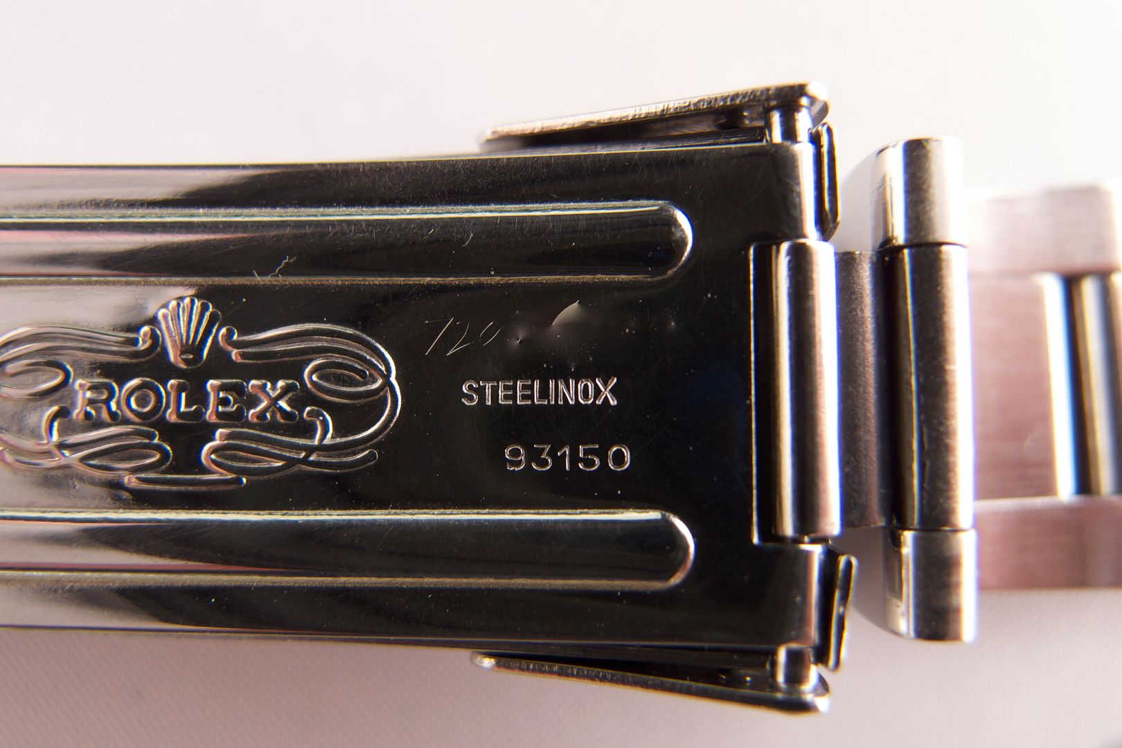  engraved serial number on Rolex 16800 Submariner 93150 bracelet