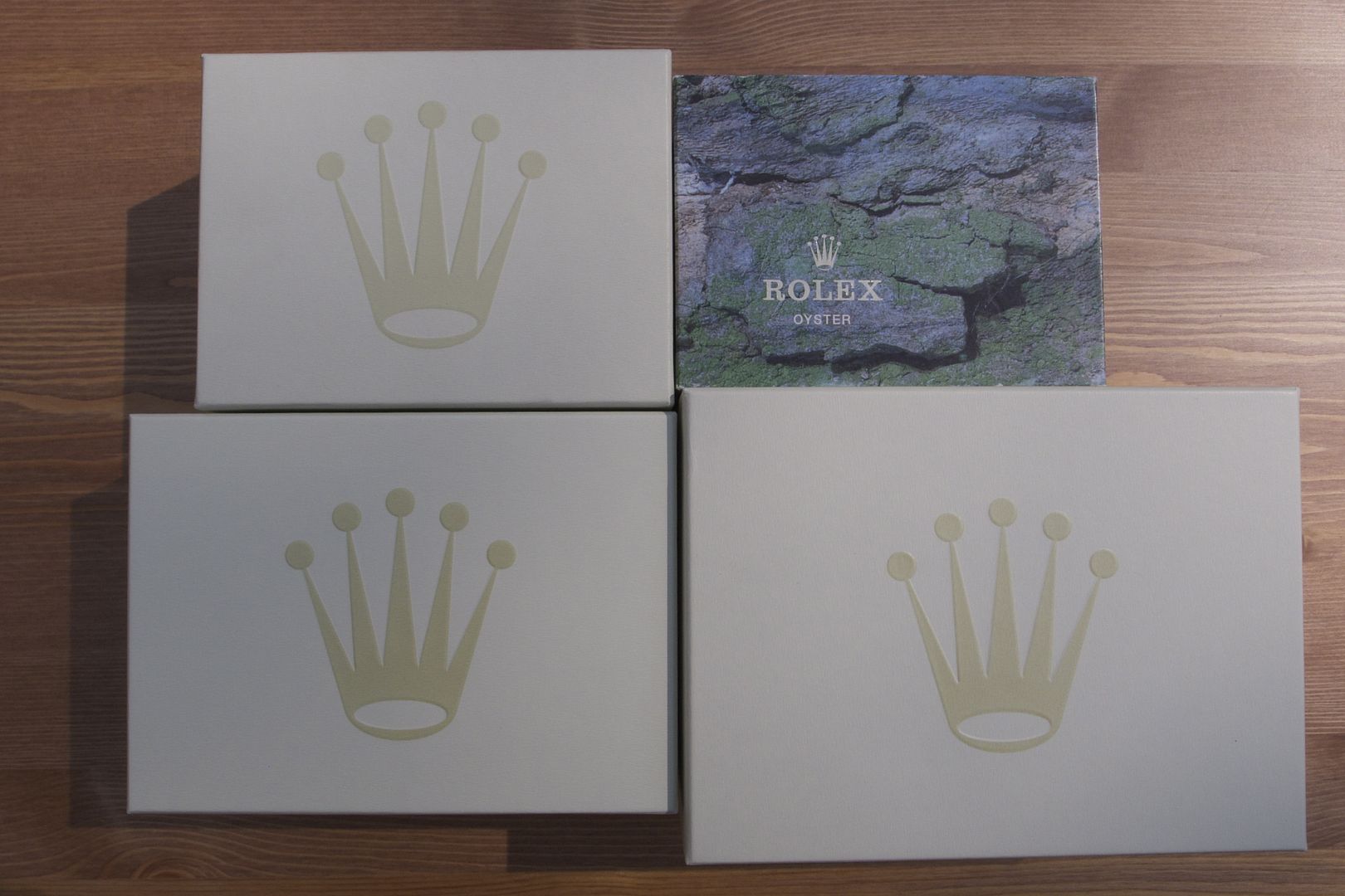 Comparison photo of Rolex green wave box sets to vintage box set